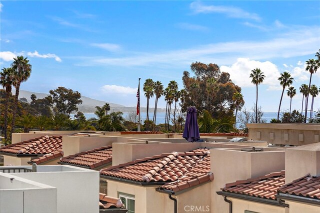 exterior space featuring a water and mountain view