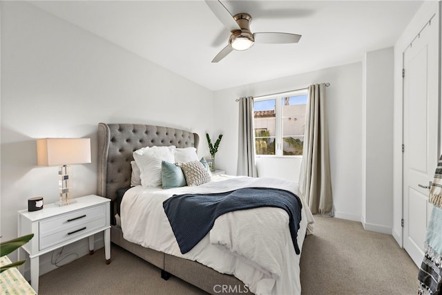 carpeted bedroom featuring ceiling fan