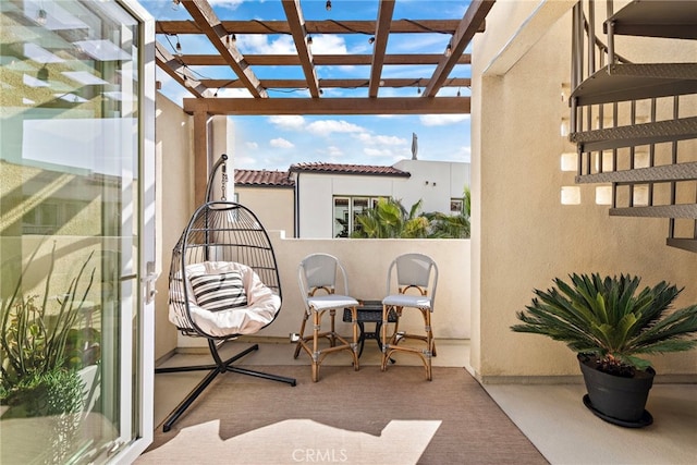 balcony featuring a pergola