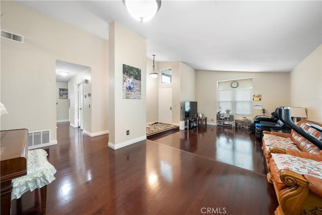 living room featuring dark hardwood / wood-style flooring