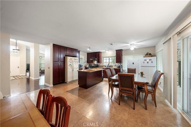 dining room featuring ceiling fan and light tile patterned floors