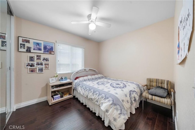 bedroom featuring ceiling fan and dark hardwood / wood-style flooring