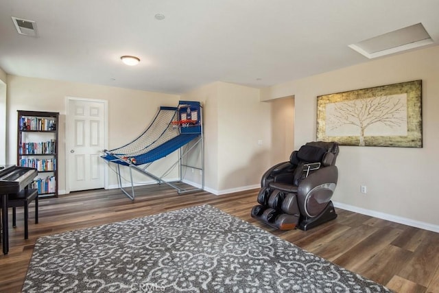 sitting room with dark hardwood / wood-style flooring