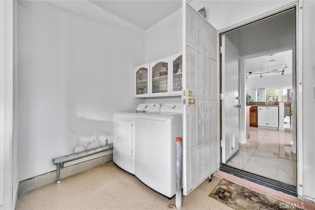 laundry area with separate washer and dryer