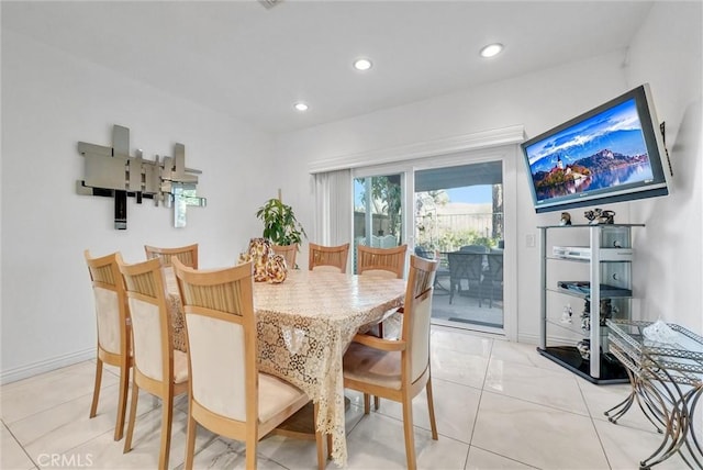 dining area with light tile patterned floors