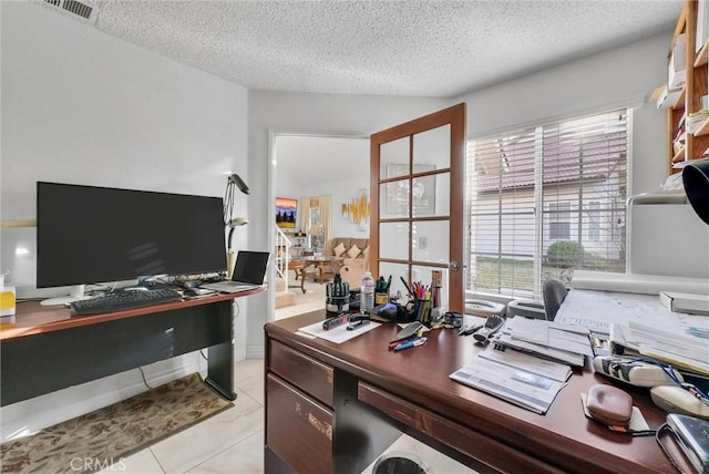 office space with a textured ceiling