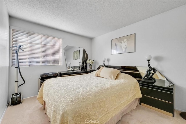 carpeted bedroom with a textured ceiling