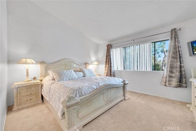 bedroom featuring light carpet and lofted ceiling