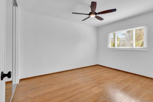 empty room featuring ceiling fan and light wood-type flooring