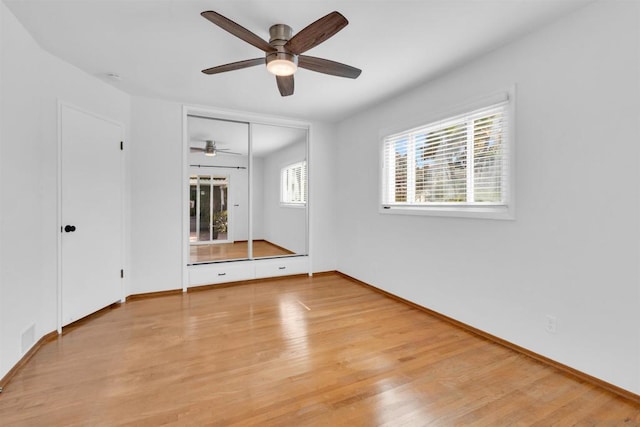 unfurnished room with light hardwood / wood-style floors and ceiling fan