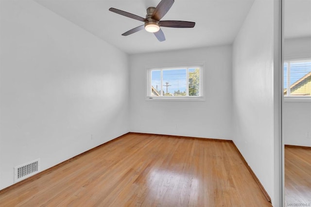 unfurnished room featuring light hardwood / wood-style floors and ceiling fan