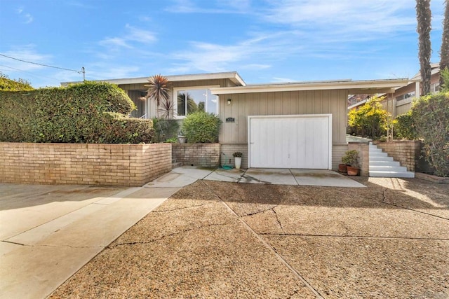 single story home with a garage