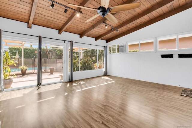 interior space featuring vaulted ceiling with beams, wood ceiling, rail lighting, and ceiling fan