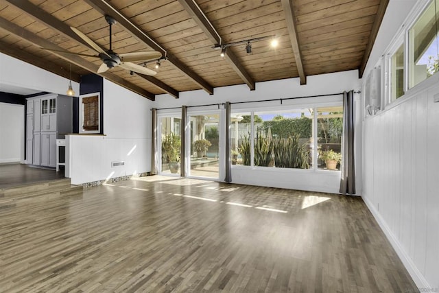 interior space with dark hardwood / wood-style flooring, wood ceiling, plenty of natural light, and lofted ceiling with beams