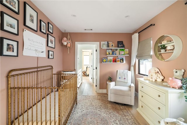 sitting room featuring light hardwood / wood-style flooring