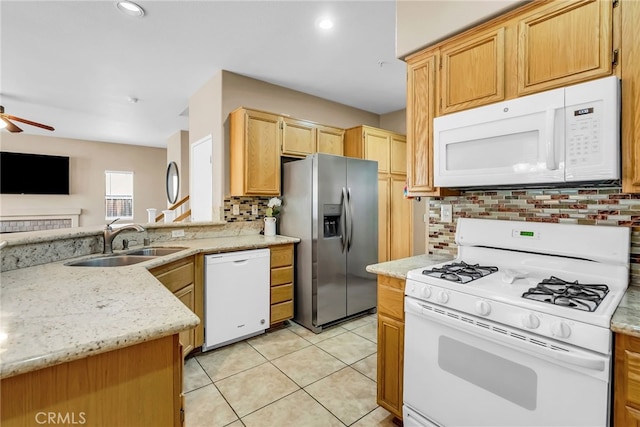 kitchen with light tile patterned flooring, sink, backsplash, ceiling fan, and white appliances