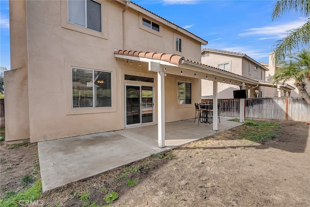 back of property with a patio area