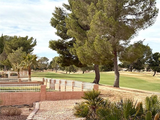 view of property's community with a lawn