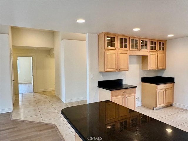 kitchen featuring light brown cabinetry and light tile patterned flooring