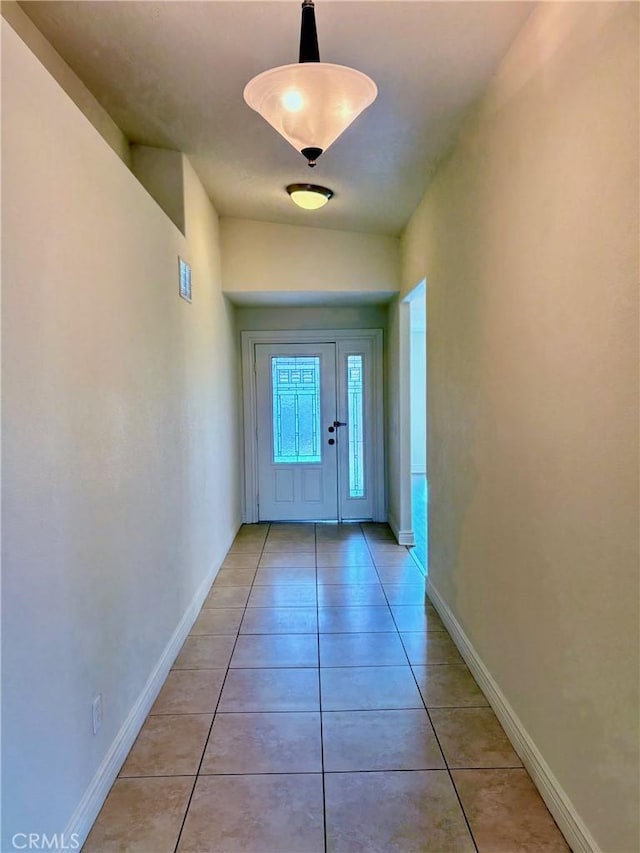 doorway to outside featuring light tile patterned floors