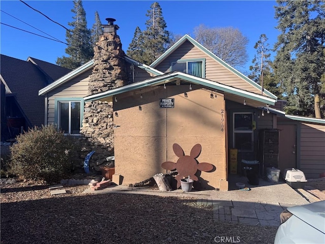 view of side of property with a patio area