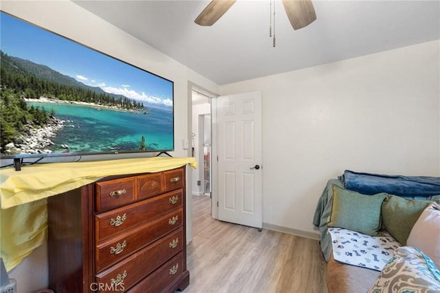 bedroom with ceiling fan and light wood-type flooring