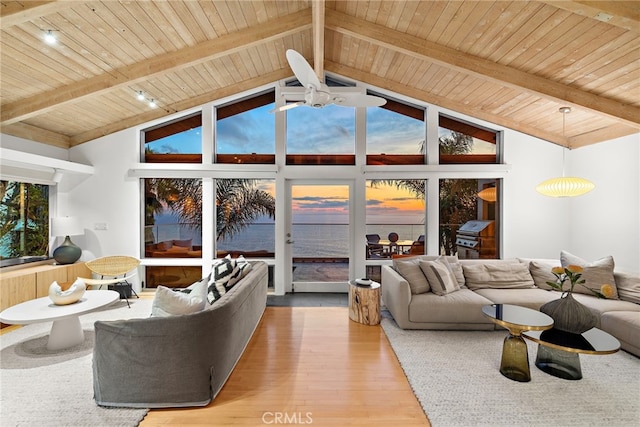 living room featuring hardwood / wood-style floors, high vaulted ceiling, ceiling fan, wood ceiling, and beam ceiling