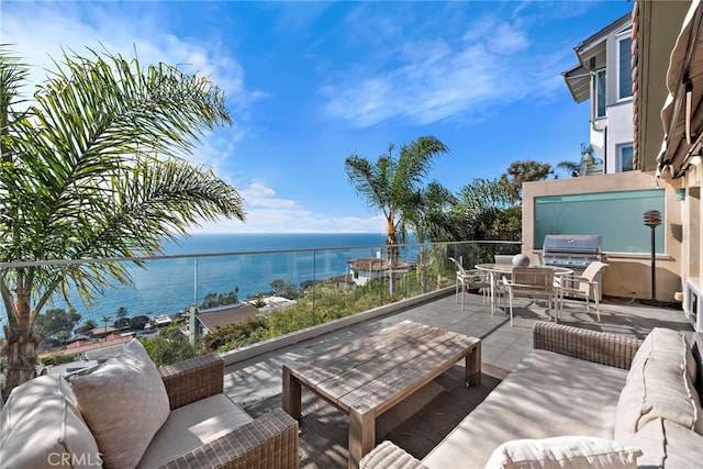 view of patio / terrace with a balcony, a water view, a grill, and an outdoor hangout area