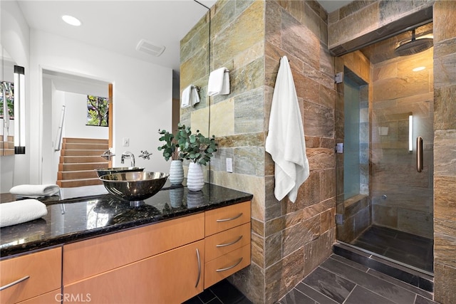 bathroom with vanity and walk in shower