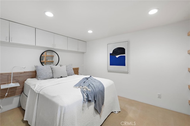 bedroom with light colored carpet