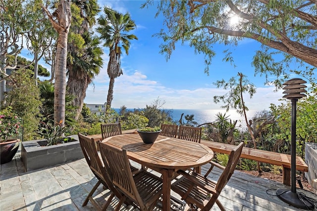 wooden terrace featuring a water view