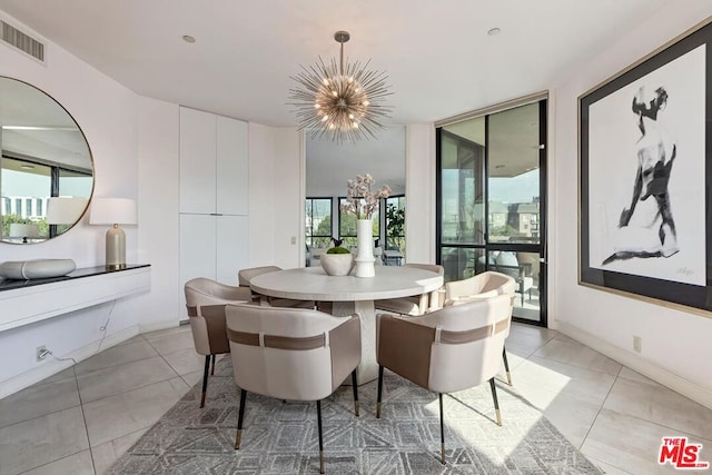 dining space with expansive windows, light tile patterned floors, and an inviting chandelier