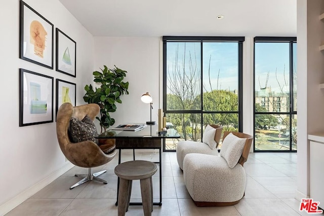 tiled office featuring floor to ceiling windows