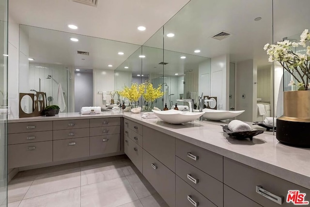 bathroom featuring vanity and an enclosed shower