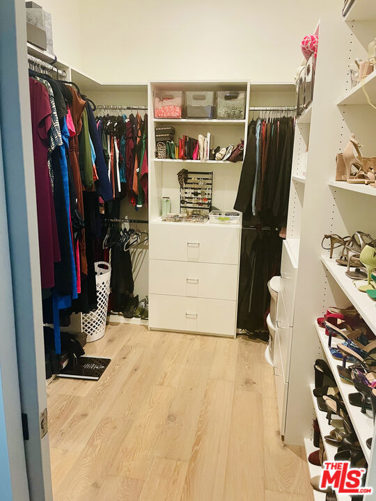 walk in closet featuring light wood-type flooring