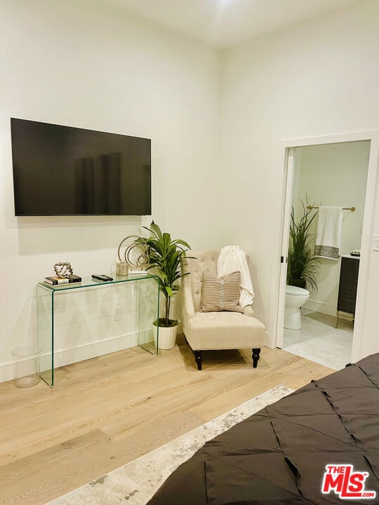 sitting room featuring hardwood / wood-style flooring