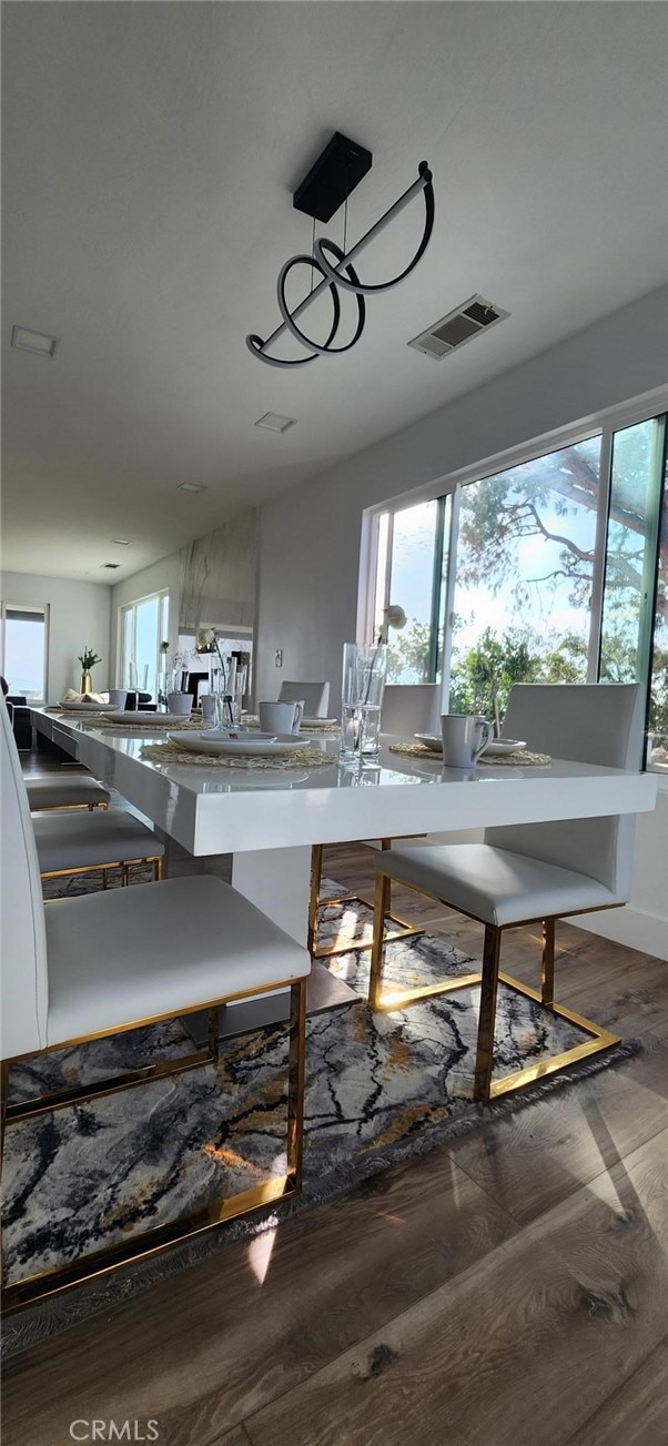 unfurnished dining area featuring dark hardwood / wood-style floors