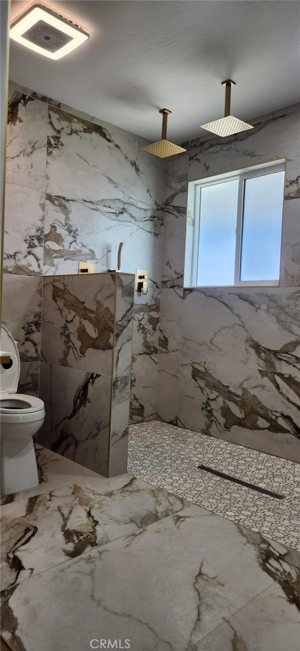 bathroom with toilet and walk in shower