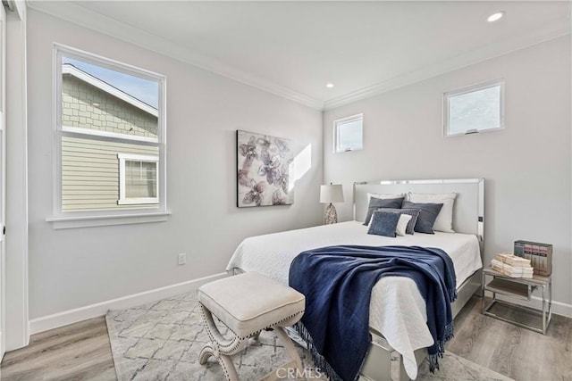 bedroom featuring hardwood / wood-style flooring and ornamental molding