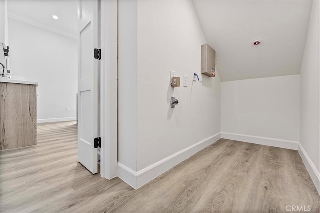 interior space featuring lofted ceiling and wood-type flooring