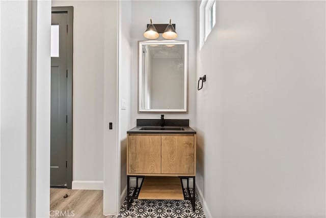 bathroom featuring vanity and hardwood / wood-style flooring