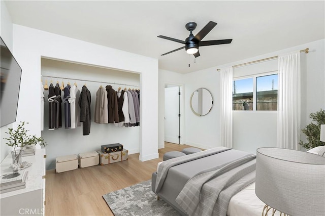 bedroom featuring a closet, ceiling fan, and light wood-type flooring