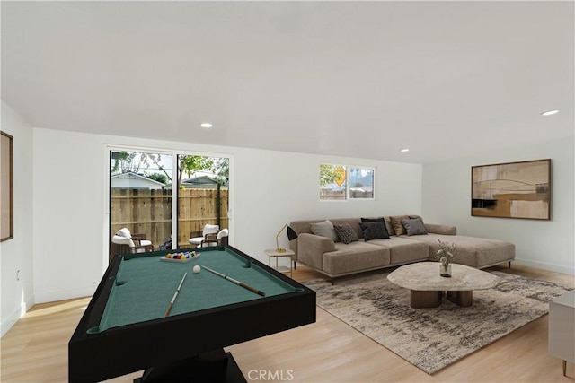 game room featuring billiards, a healthy amount of sunlight, and light hardwood / wood-style floors