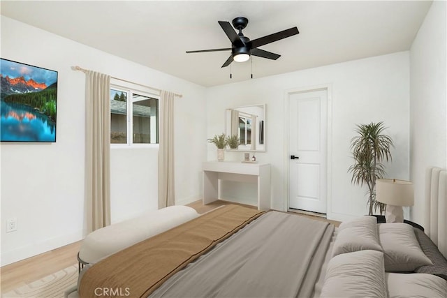 bedroom featuring ceiling fan and light hardwood / wood-style flooring