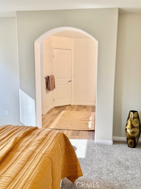 unfurnished bedroom with light colored carpet