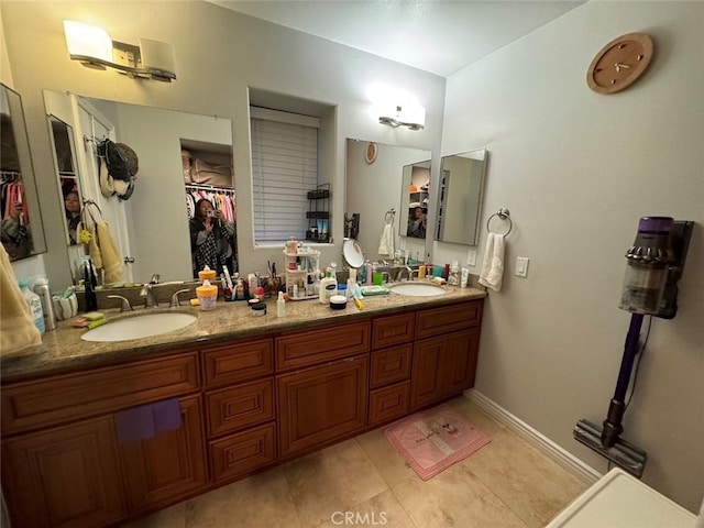 bathroom with vanity and tile patterned floors