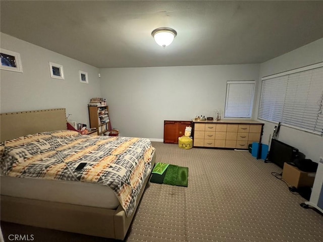 bedroom featuring light carpet