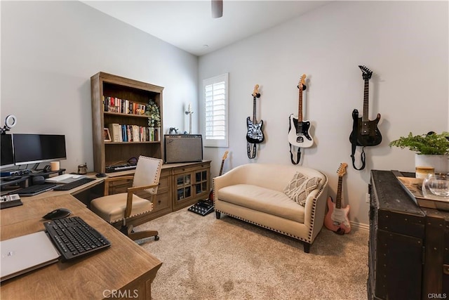 home office with a ceiling fan and light colored carpet