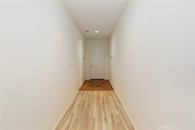 corridor featuring light hardwood / wood-style flooring