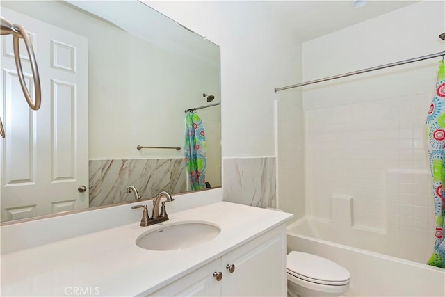 full bathroom featuring vanity, shower / bath combination with curtain, and toilet